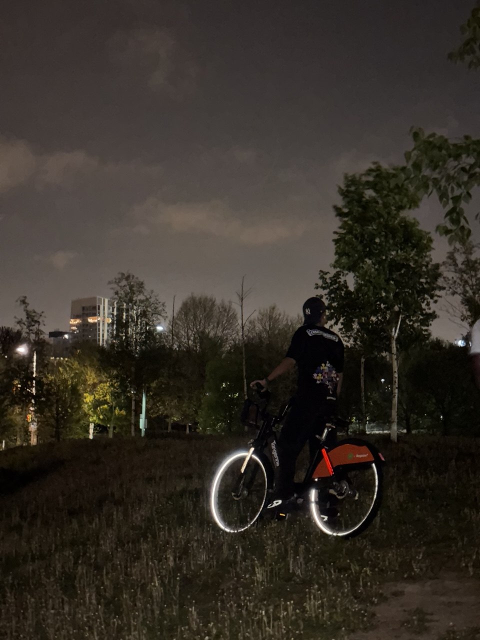 Tony cycling through Toronto at night